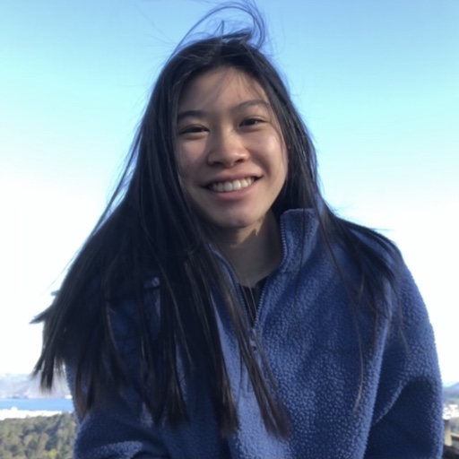 Hannah smiling on top of a hill