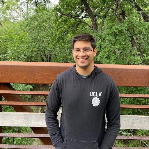 Rohan posing on a bridge